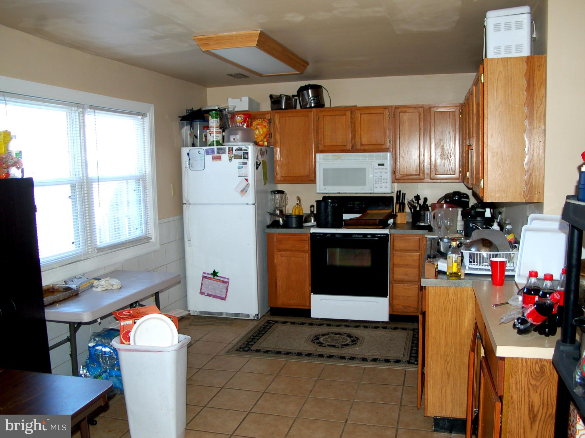 820 Anvil Road Fredericksburg, VA 22405 - Photo 7 of 10 a kitchen with stainless steel appliances a refrigerator sink and cabinets