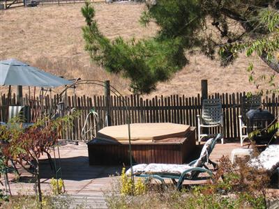4103 Sonoma Mountain Road Santa Rosa, CA 95404 - Photo 3 of 8 a view of a patio with a table chairs and a barbeque