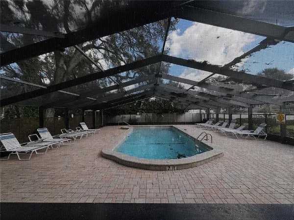 a view of a swimming pool with a patio