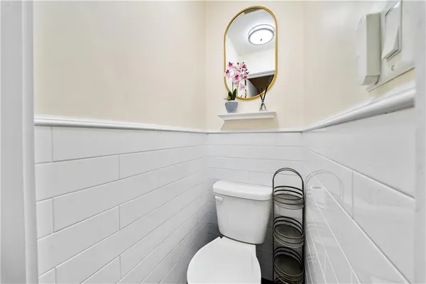 a bathroom with a toilet and a sink