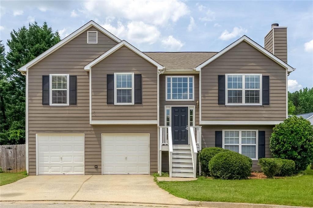 3272 Peach Court Acworth, GA 30101 - Photo 1 of 52 a front view of a house with a garden