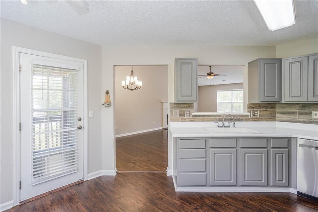3272 Peach Court Acworth, GA 30101 - Photo 13 of 52 a kitchen with a sink cabinets and wooden floor