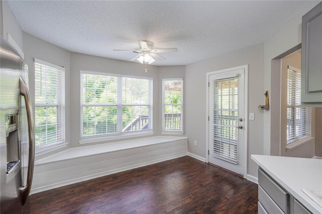 3272 Peach Court Acworth, GA 30101 - Photo 15 of 52 a view of an empty room with a window and wooden floor