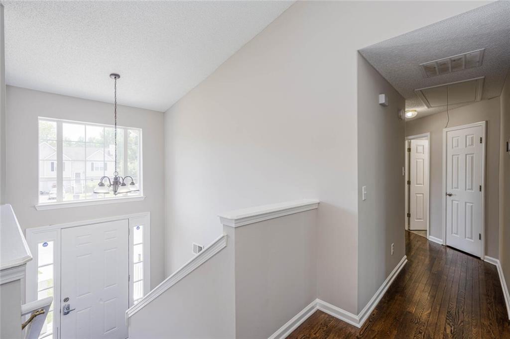 3272 Peach Court Acworth, GA 30101 - Photo 16 of 52 a view of a hallway with wooden floor and staircase
