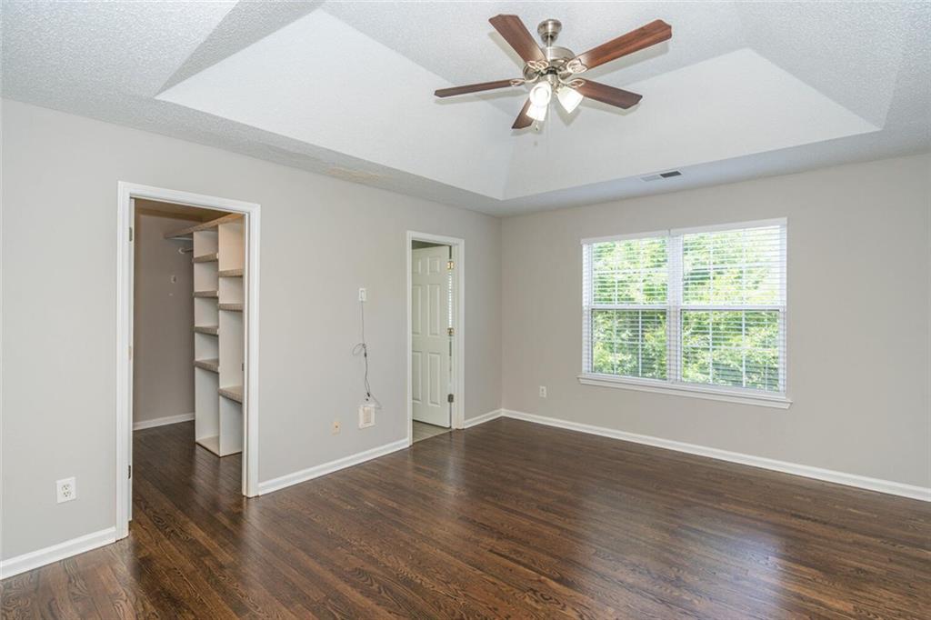 3272 Peach Court Acworth, GA 30101 - Photo 17 of 52 an empty room with wooden floor and windows