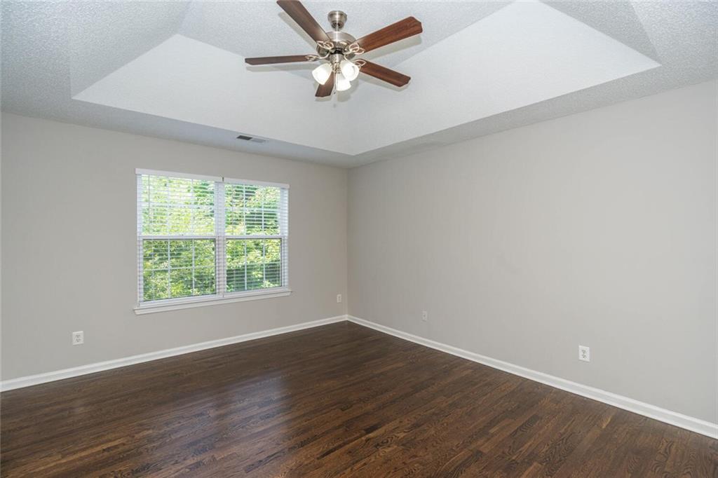 3272 Peach Court Acworth, GA 30101 - Photo 19 of 52 a view of an empty room with wooden floor and a window
