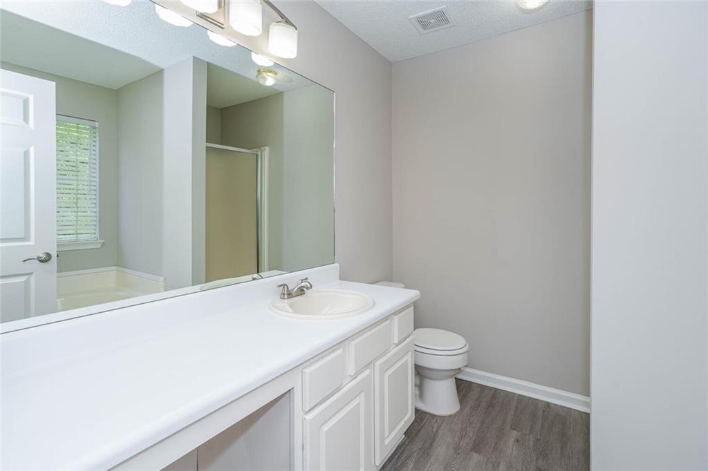 3272 Peach Court Acworth, GA 30101 - Photo 21 of 52 a bathroom with a sink a toilet and shower