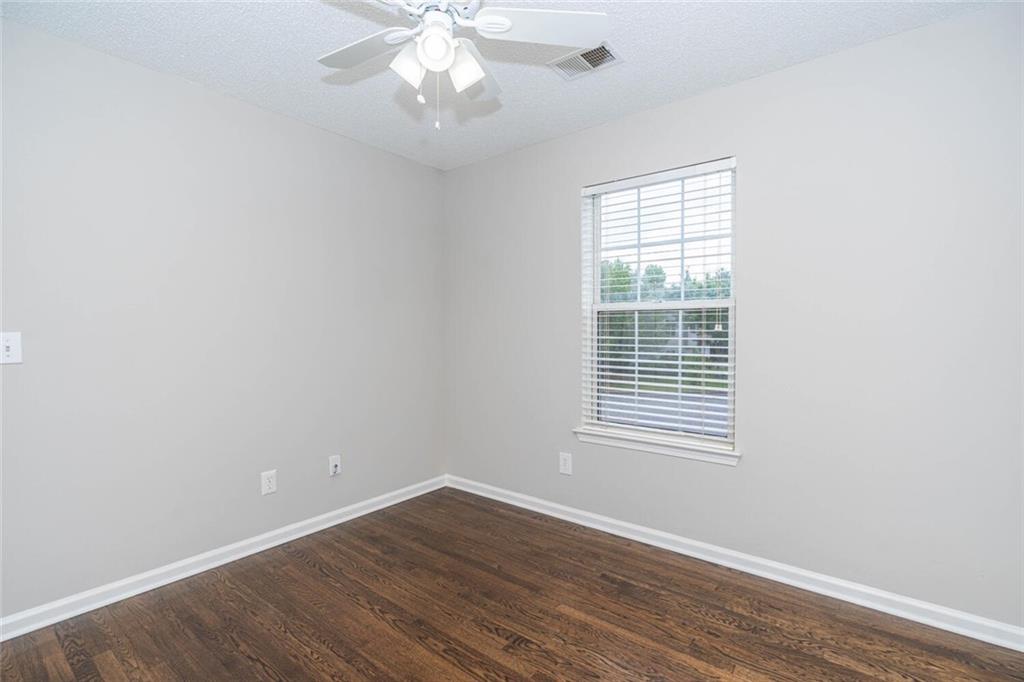 3272 Peach Court Acworth, GA 30101 - Photo 31 of 52 an empty room with wooden floor and windows