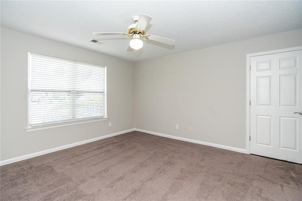 3272 Peach Court Acworth, GA 30101 - Photo 35 of 52 an empty room with windows and fan