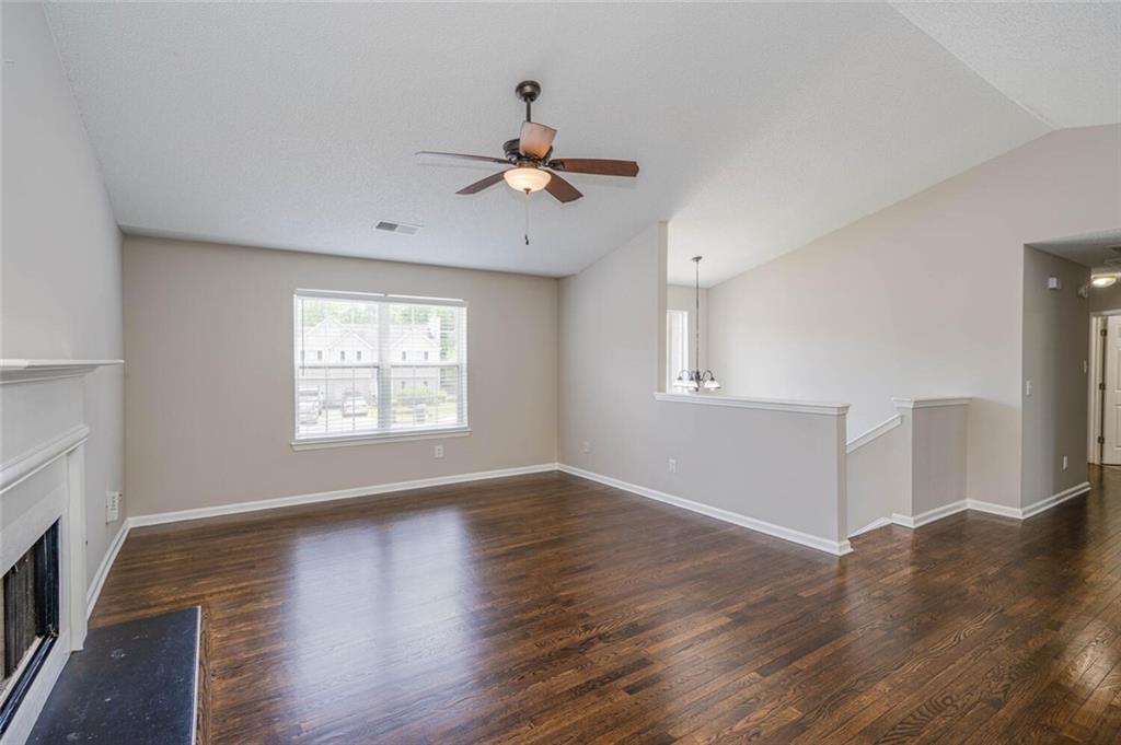 3272 Peach Court Acworth, GA 30101 - Photo 6 of 52 a view of an empty room with wooden floor and a window