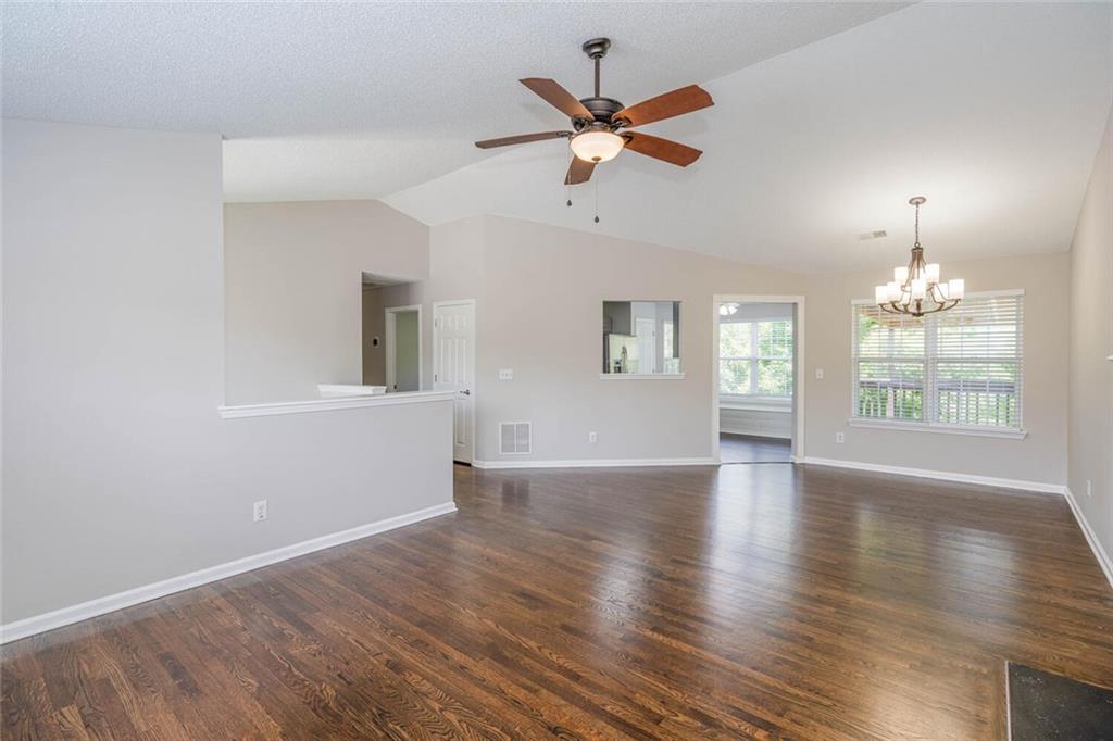 3272 Peach Court Acworth, GA 30101 - Photo 7 of 52 an empty room with wooden floor fan and windows