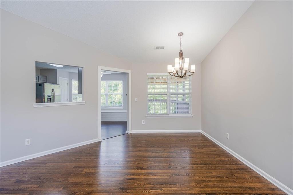 3272 Peach Court Acworth, GA 30101 - Photo 9 of 52 an empty room with wooden floor and windows