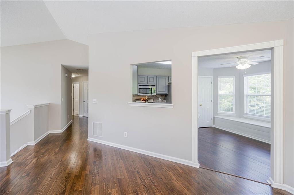 3272 Peach Court Acworth, GA 30101 - Photo 10 of 52 wooden floor in an empty room with a window