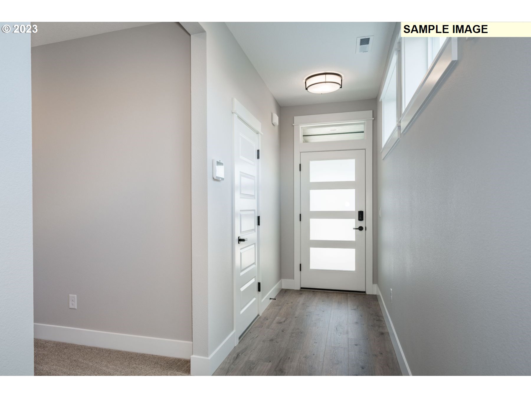 1101 South 46th Place Ridgefield, WA 98642 - Photo 4 of 22 a view of an entryway with wooden floor