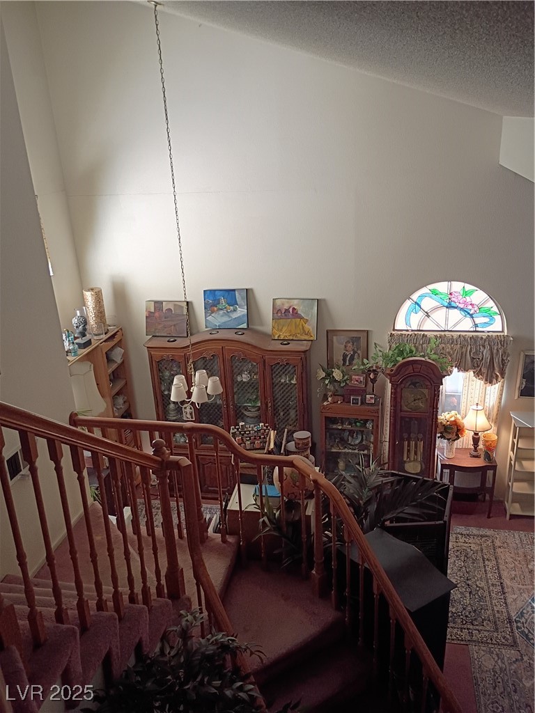 934 Derringer Lane Henderson, NV 89014 - Photo 12 of 49 Stairway featuring a textured ceiling and carpet flooring