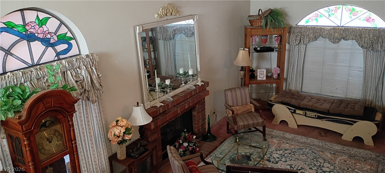934 Derringer Lane Henderson, NV 89014 - Photo 13 of 49 Living area brick fireplace stain glass windows, vaulted ceilings
