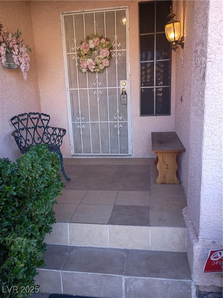 934 Derringer Lane Henderson, NV 89014 - Photo 2 of 49 Foyer featuring stairs and light tile patterned floors
