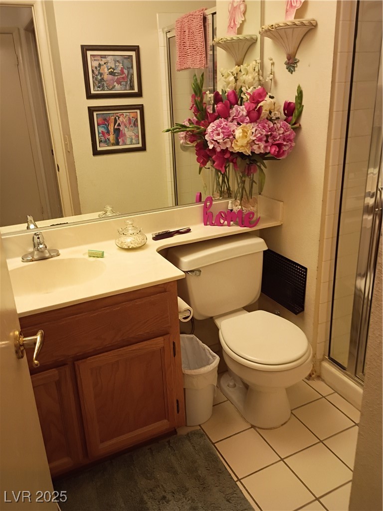 934 Derringer Lane Henderson, NV 89014 - Photo 27 of 49 doown stair 3/4
Bathroom featuring vanity, a stall shower, and dark tile patterned flooring
