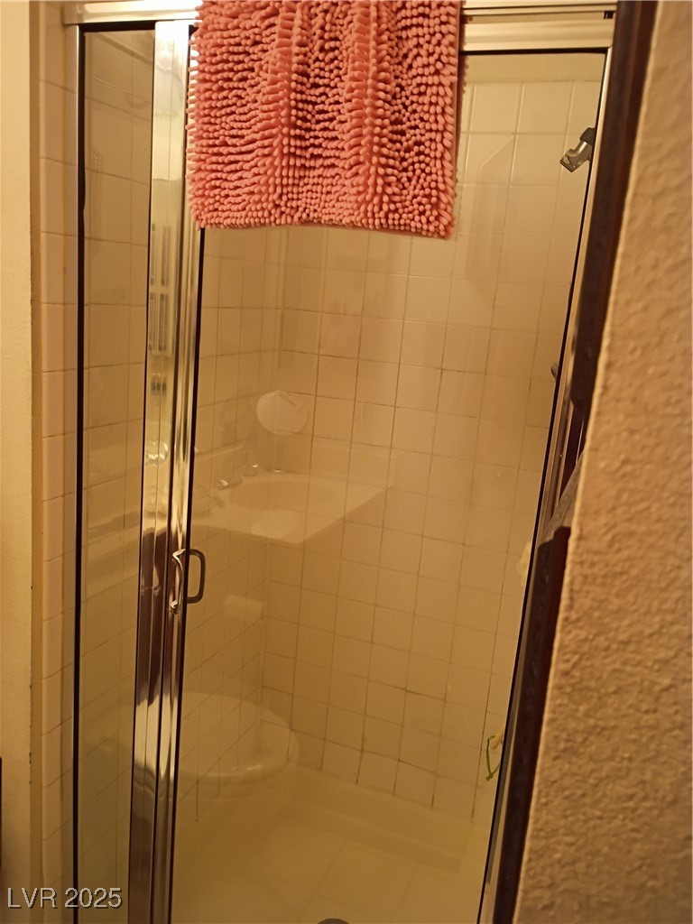 934 Derringer Lane Henderson, NV 89014 - Photo 28 of 49 3/4 downstairs
bath featuring a shower stall