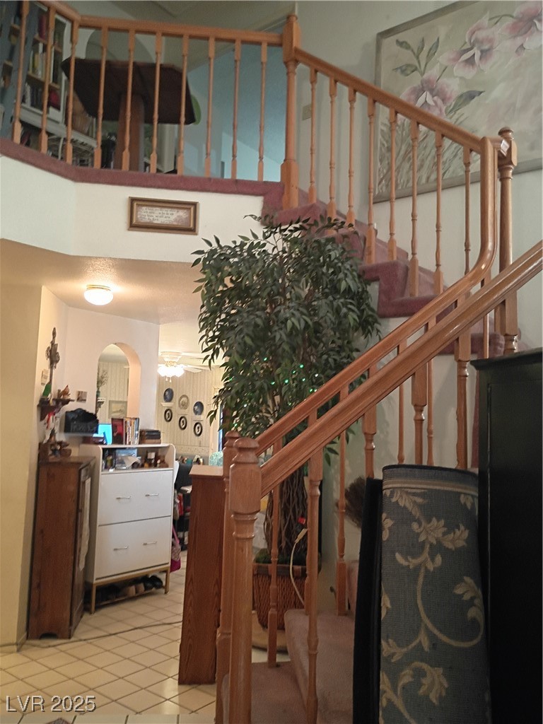 934 Derringer Lane Henderson, NV 89014 - Photo 31 of 49 Stairs with a towering ceiling, upgraded banisters