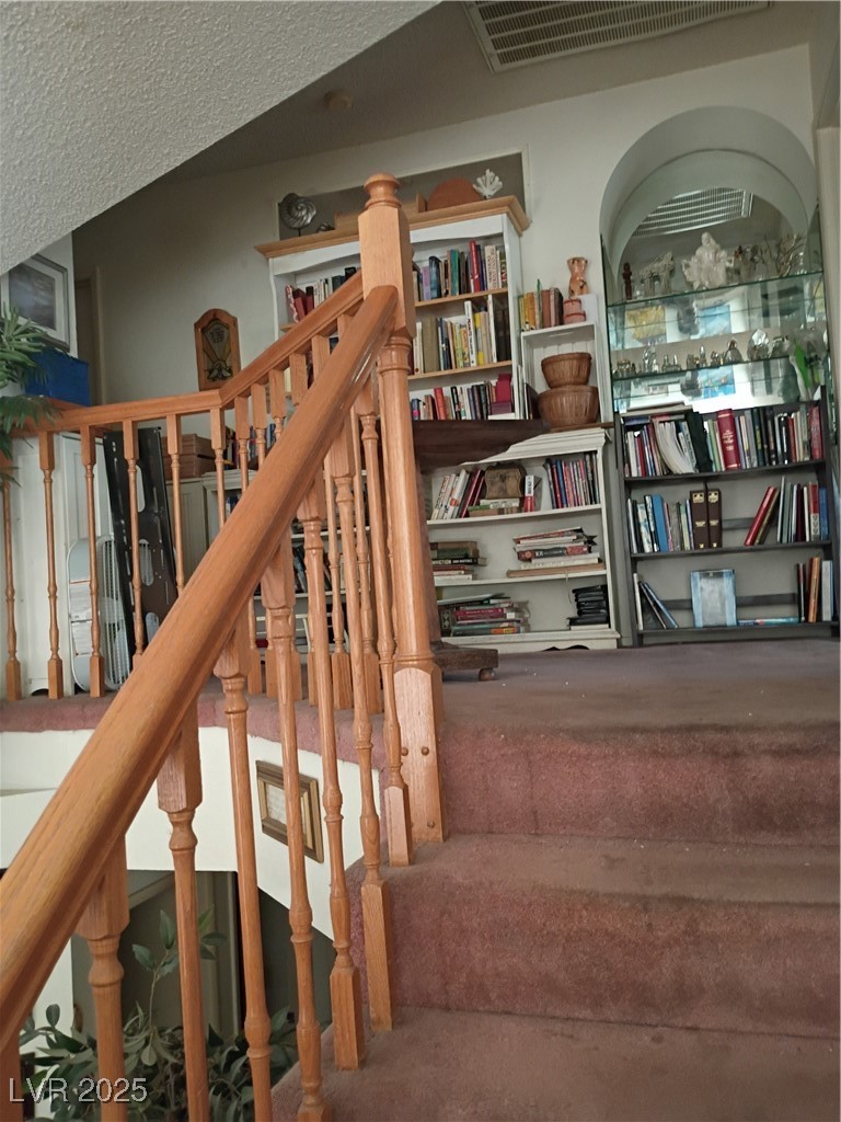 934 Derringer Lane Henderson, NV 89014 - Photo 32 of 49 View of staircase, glass , arched curio built in