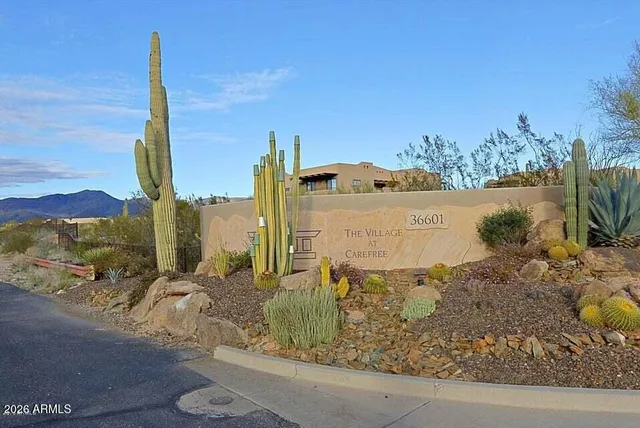 a view of a ocean with a mountain in the background