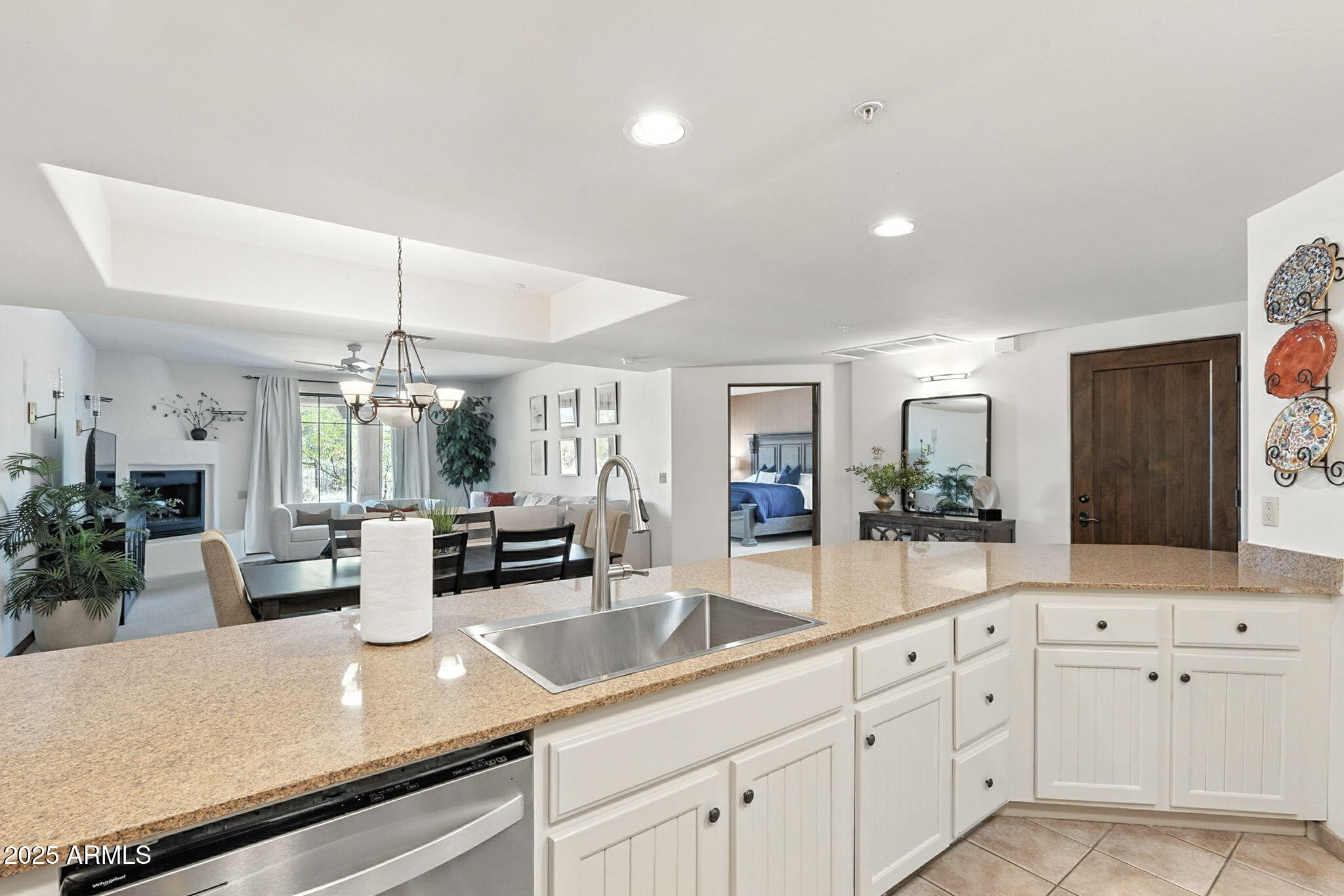 36601 North Mule Train Road, Unit B19 Carefree, AZ 85377 - Photo 14 of 53 a kitchen with white cabinets and sink