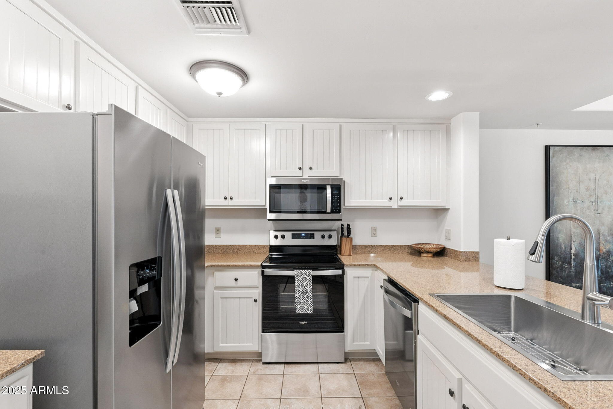 36601 North Mule Train Road, Unit B19 Carefree, AZ 85377 - Photo 16 of 53 a kitchen with stainless steel appliances granite countertop a refrigerator stove and sink