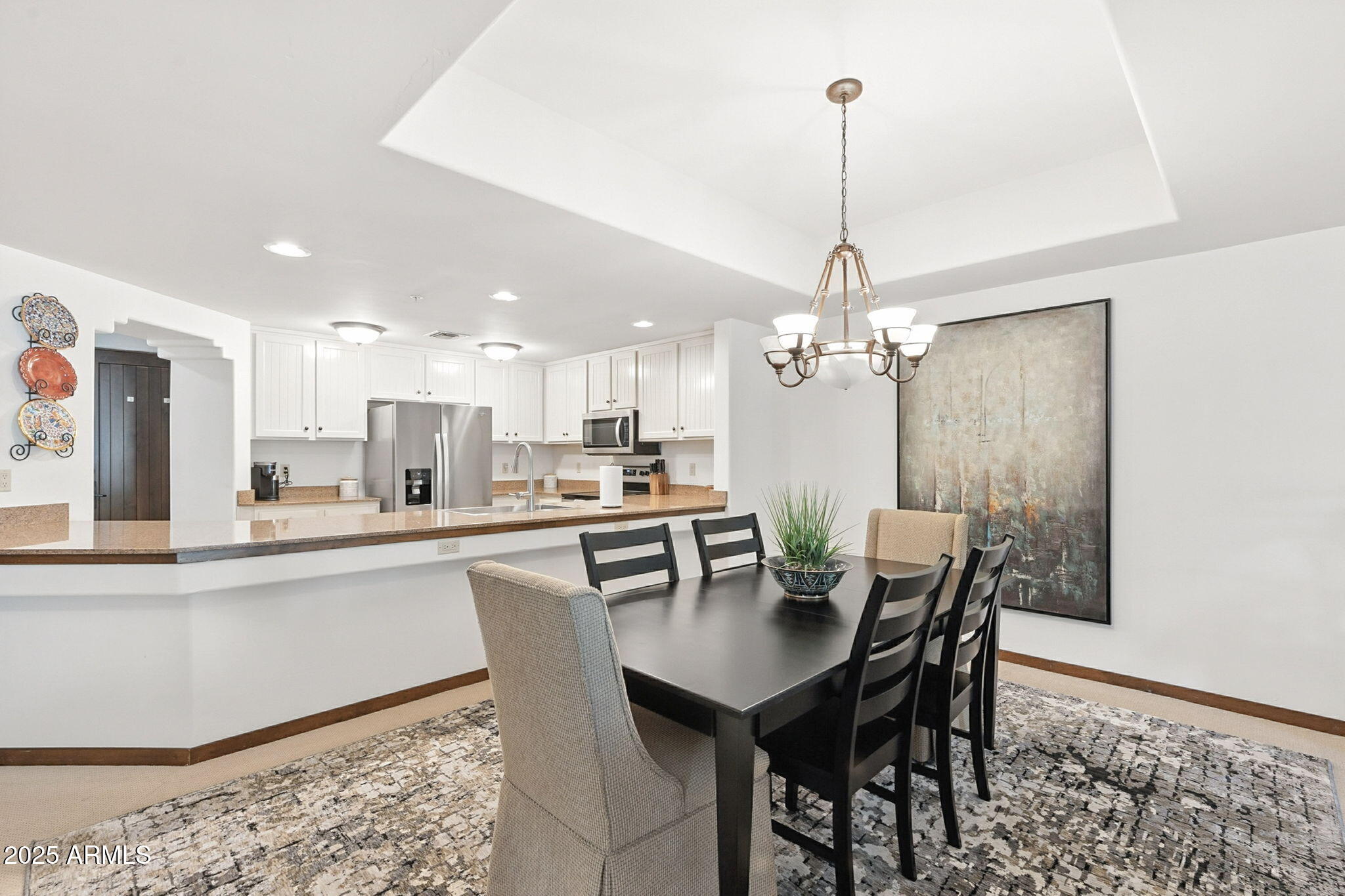 36601 North Mule Train Road, Unit B19 Carefree, AZ 85377 - Photo 20 of 53 a dining room with furniture and window