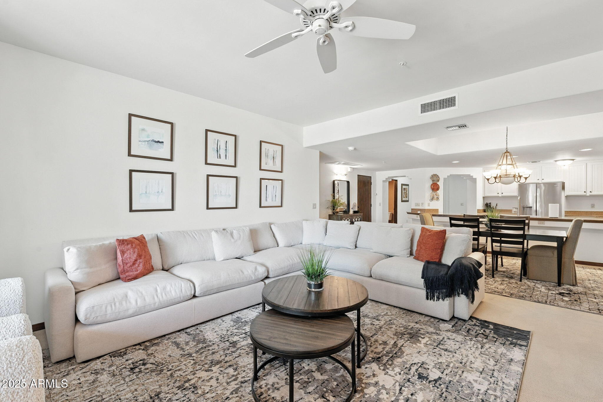 36601 North Mule Train Road, Unit B19 Carefree, AZ 85377 - Photo 22 of 48 a living room with furniture and a view of kitchen