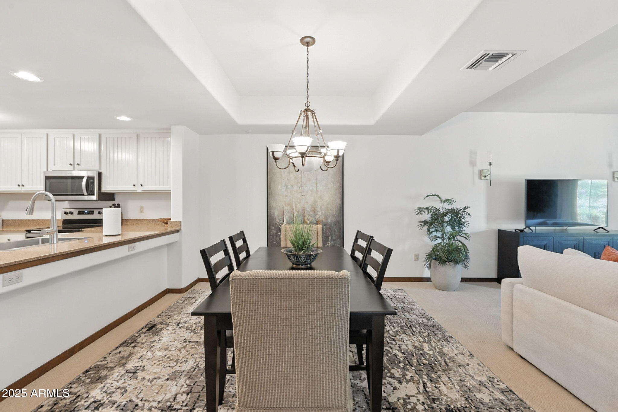 36601 North Mule Train Road, Unit B19 Carefree, AZ 85377 - Photo 23 of 53 a living room with furniture and a chandelier