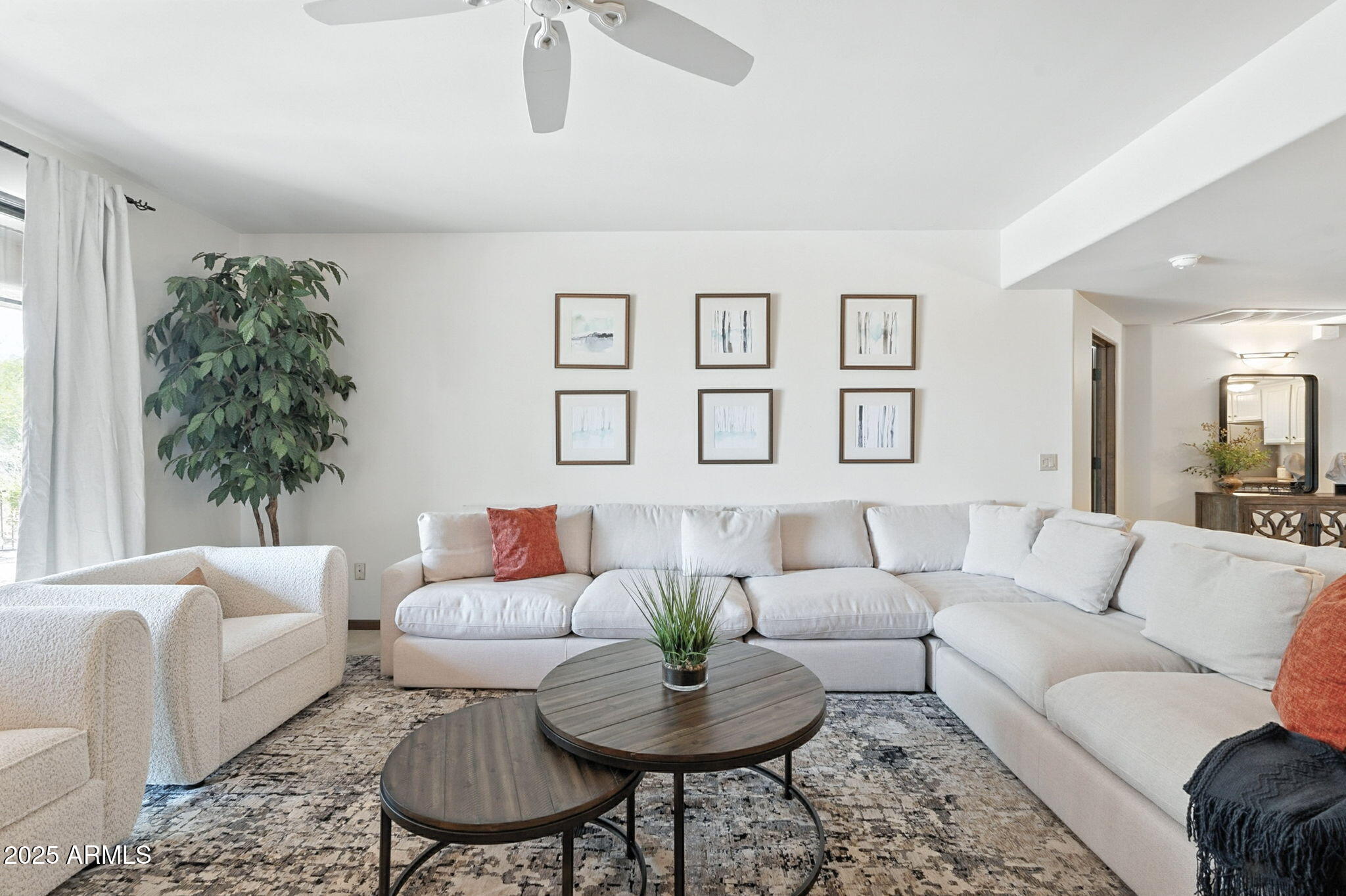 36601 North Mule Train Road, Unit B19 Carefree, AZ 85377 - Photo 28 of 53 a living room with furniture and a large window