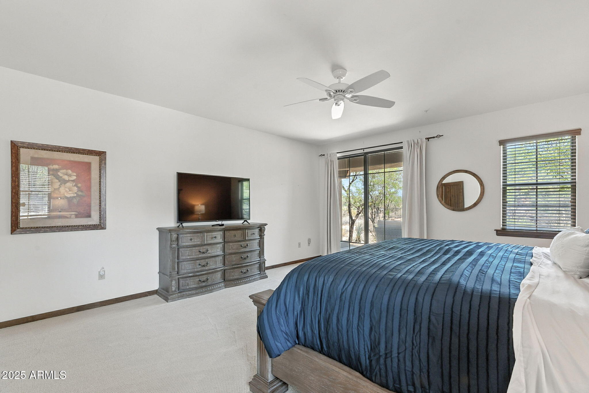 36601 North Mule Train Road, Unit B19 Carefree, AZ 85377 - Photo 30 of 48 a bedroom with a bed and a flat screen tv