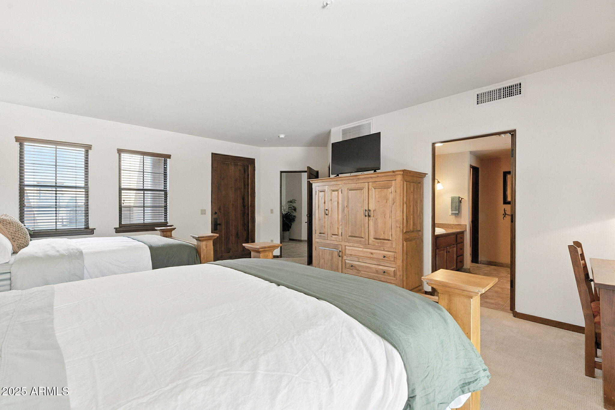 36601 North Mule Train Road, Unit B19 Carefree, AZ 85377 - Photo 30 of 53 a bedroom with a bed and a dresser