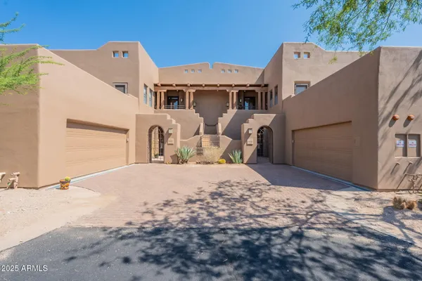 a front view of a house with parking
