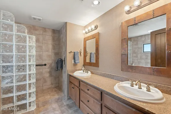 a bathroom with a bathtub and shower