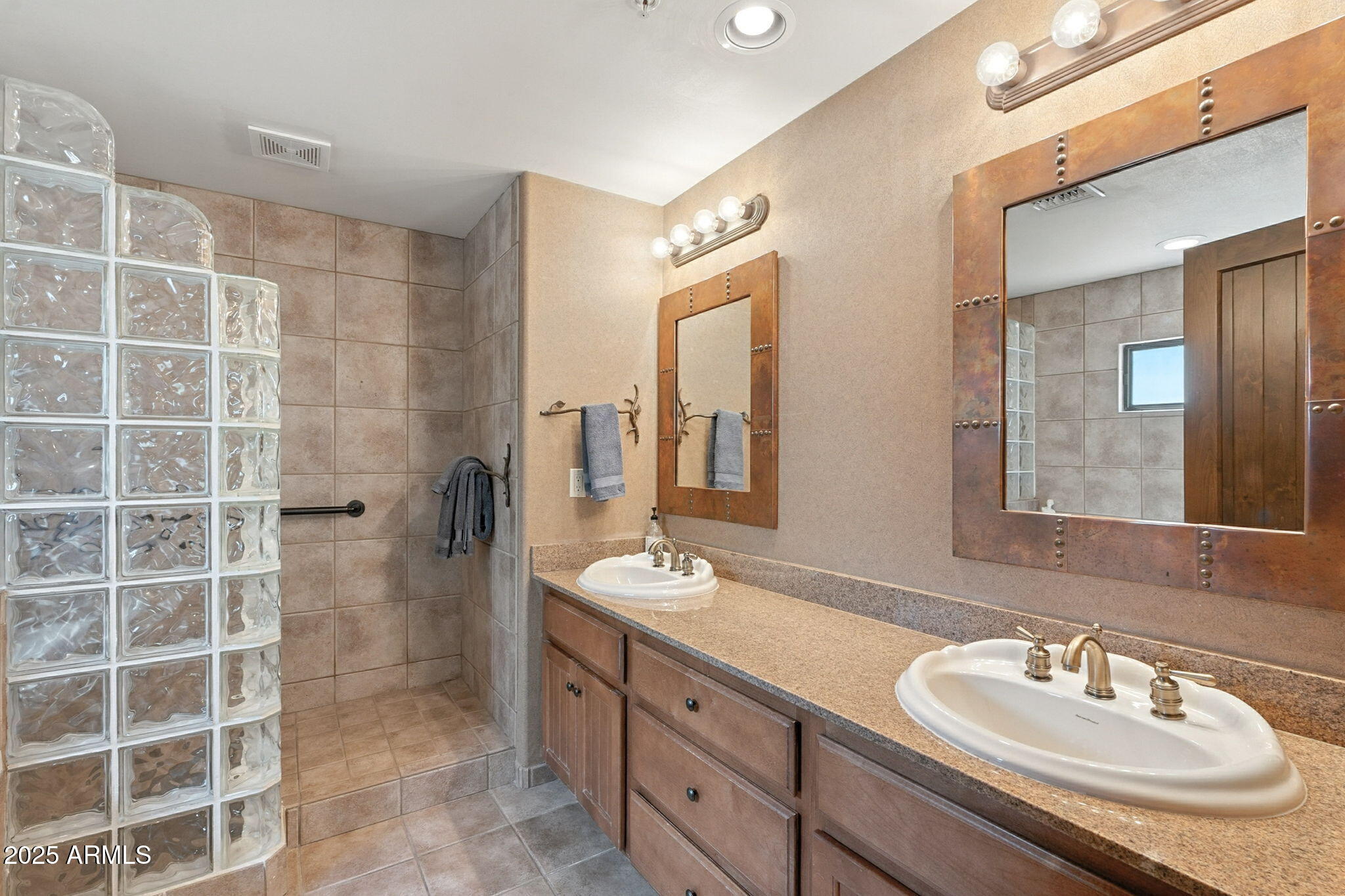 36601 North Mule Train Road, Unit B19 Carefree, AZ 85377 - Photo 33 of 48 a bathroom with a sink double vanity and a mirror