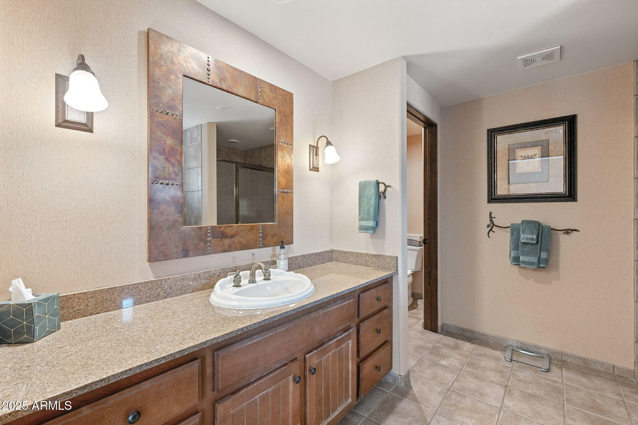 36601 North Mule Train Road, Unit B19 Carefree, AZ 85377 - Photo 33 of 53 a bathroom with a sink and a mirror