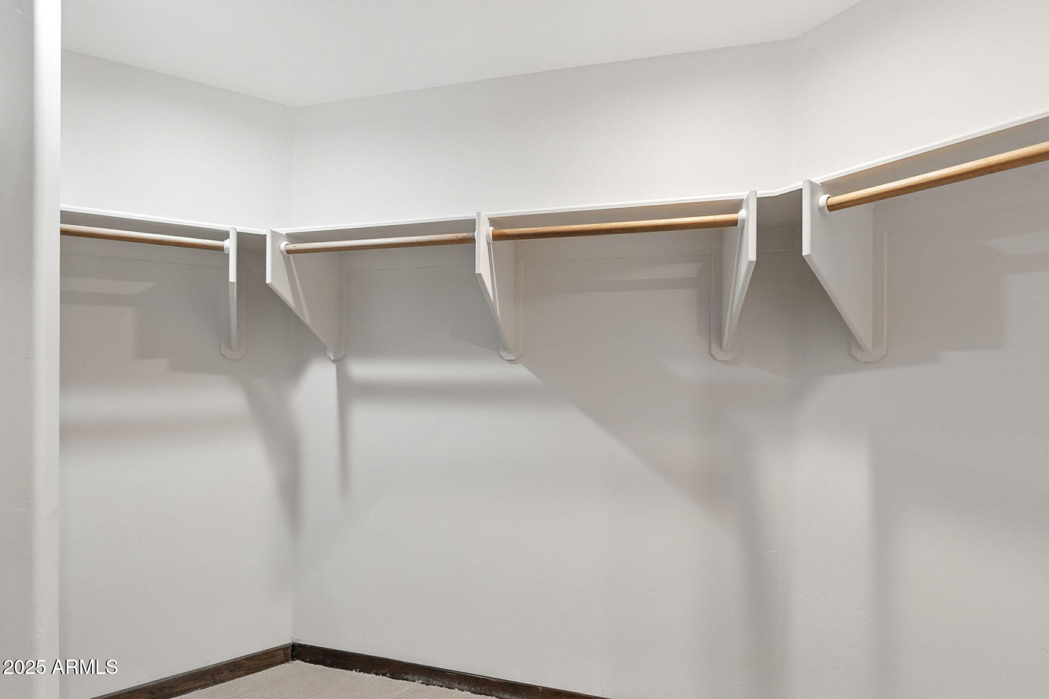 36601 North Mule Train Road, Unit B19 Carefree, AZ 85377 - Photo 36 of 48 a view of walk in closet with empty racks