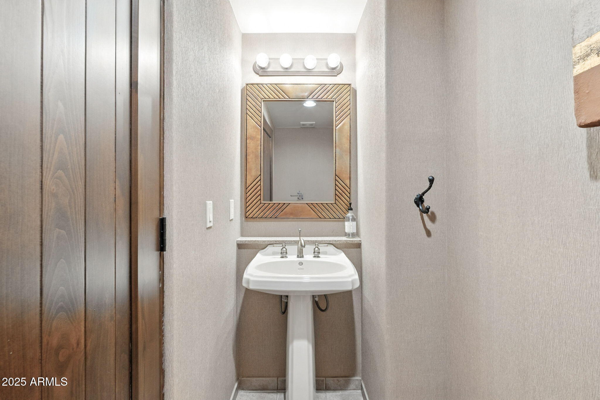 36601 North Mule Train Road, Unit B19 Carefree, AZ 85377 - Photo 37 of 53 a bathroom with a sink and a mirror