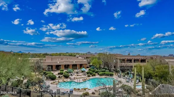 a view of swimming pool from a balcony