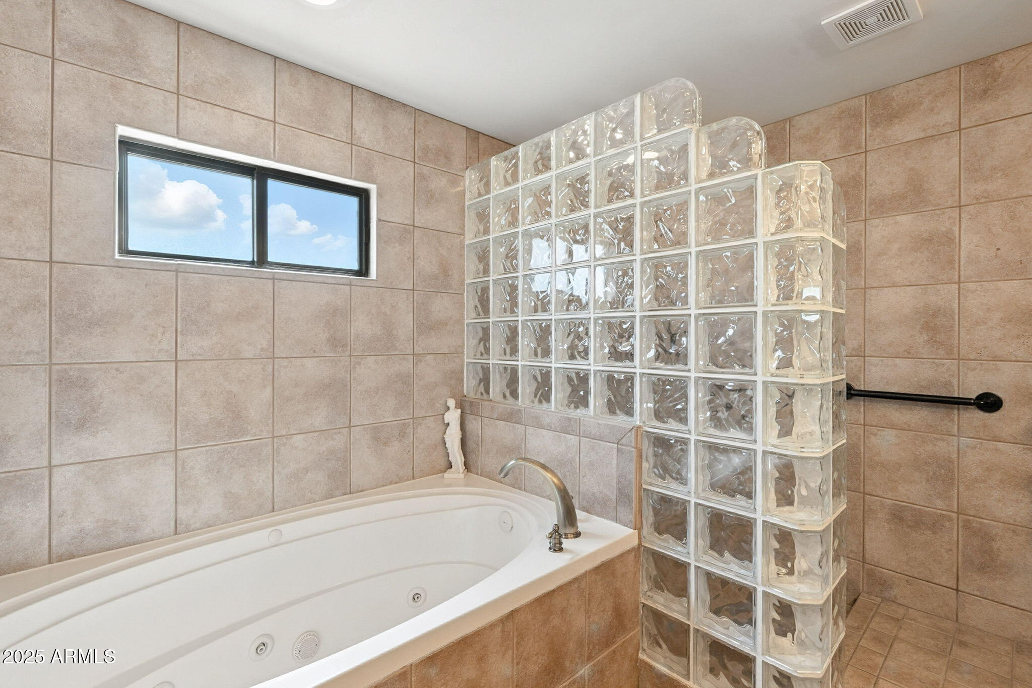 36601 North Mule Train Road, Unit B19 Carefree, AZ 85377 - Photo 44 of 53 a bathroom with a bathtub and shower