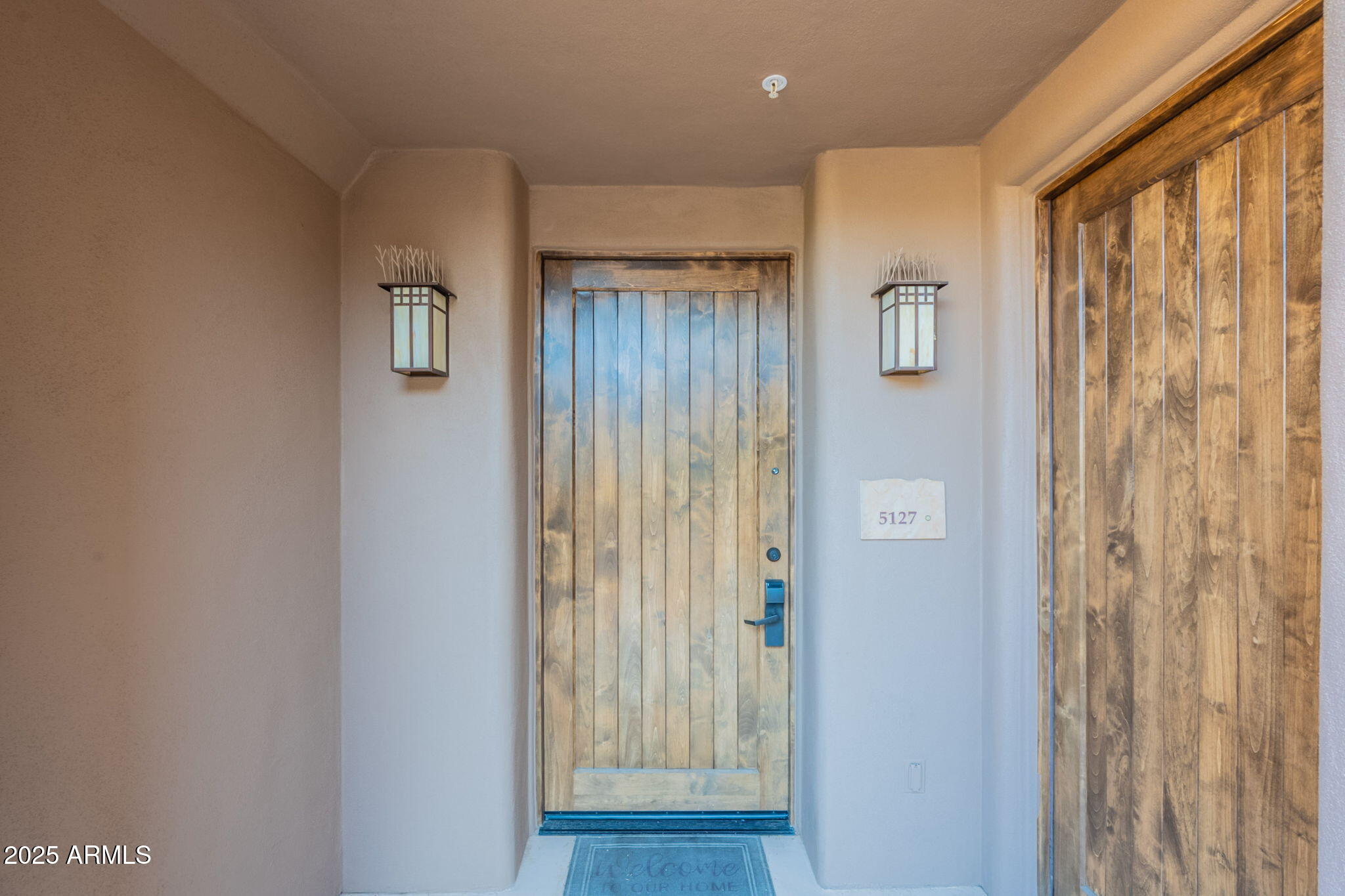 36601 North Mule Train Road, Unit B19 Carefree, AZ 85377 - Photo 9 of 48 a view of a hallway with wooden floor and a bathroom