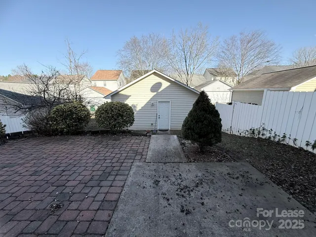 a view of a backyard of the house