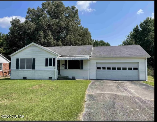 a house with trees in front of it