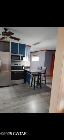 a view of kitchen with breakfast area