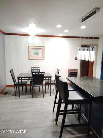 a view of a dining room with furniture