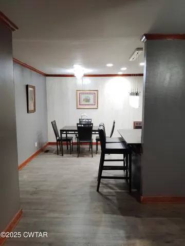 a view of a livingroom with furniture and wooden floor