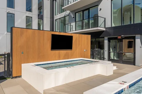 a view of swimming pool from a balcony