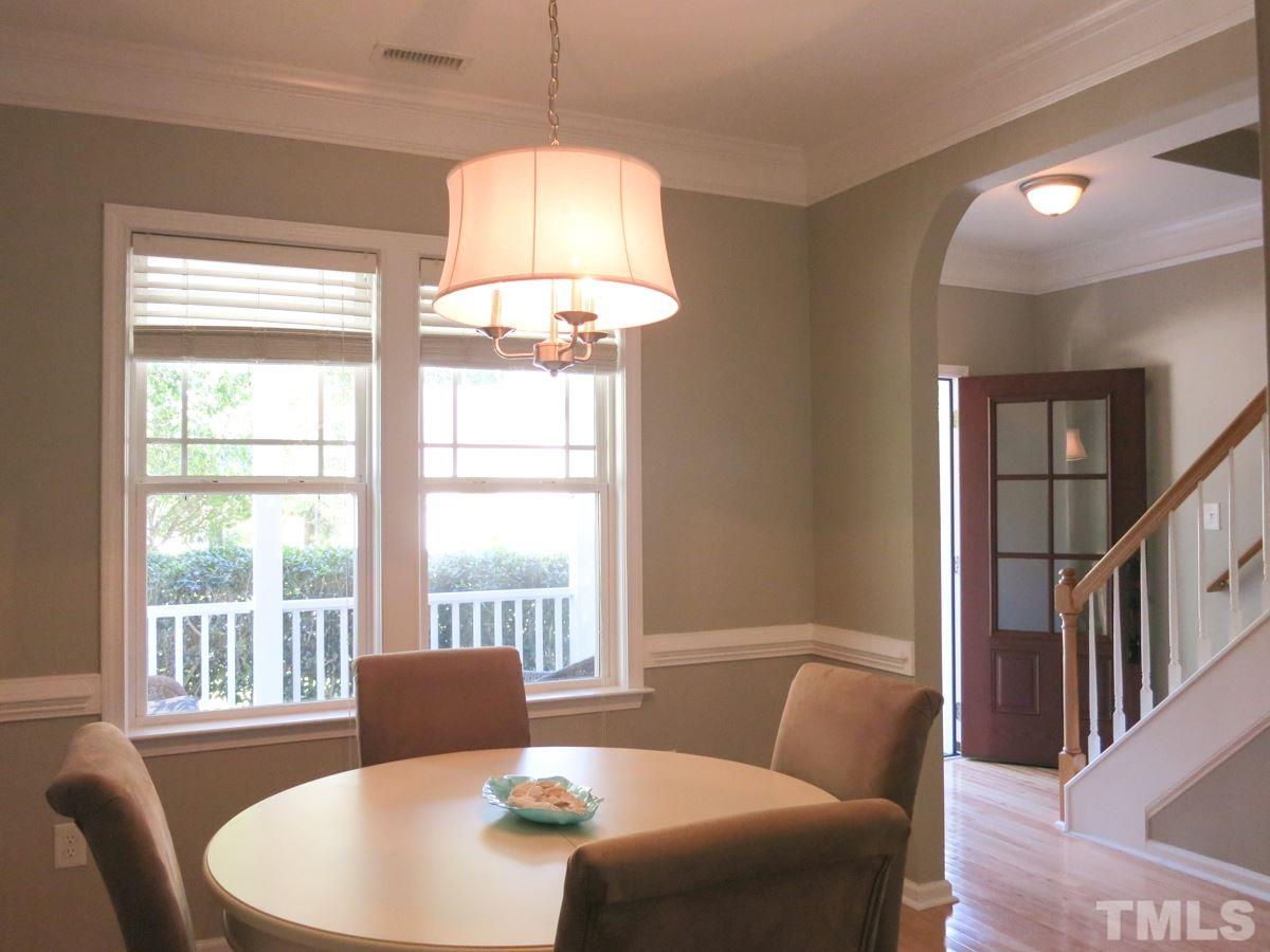 4629 Landover Crest Drive Raleigh, NC 27616 - Photo 4 of 25 Lg arched doorway in Foyer leads to formal Dining Rm w/brushed nickel light fixture, hardwood floor and deep crown & chair rail molding.